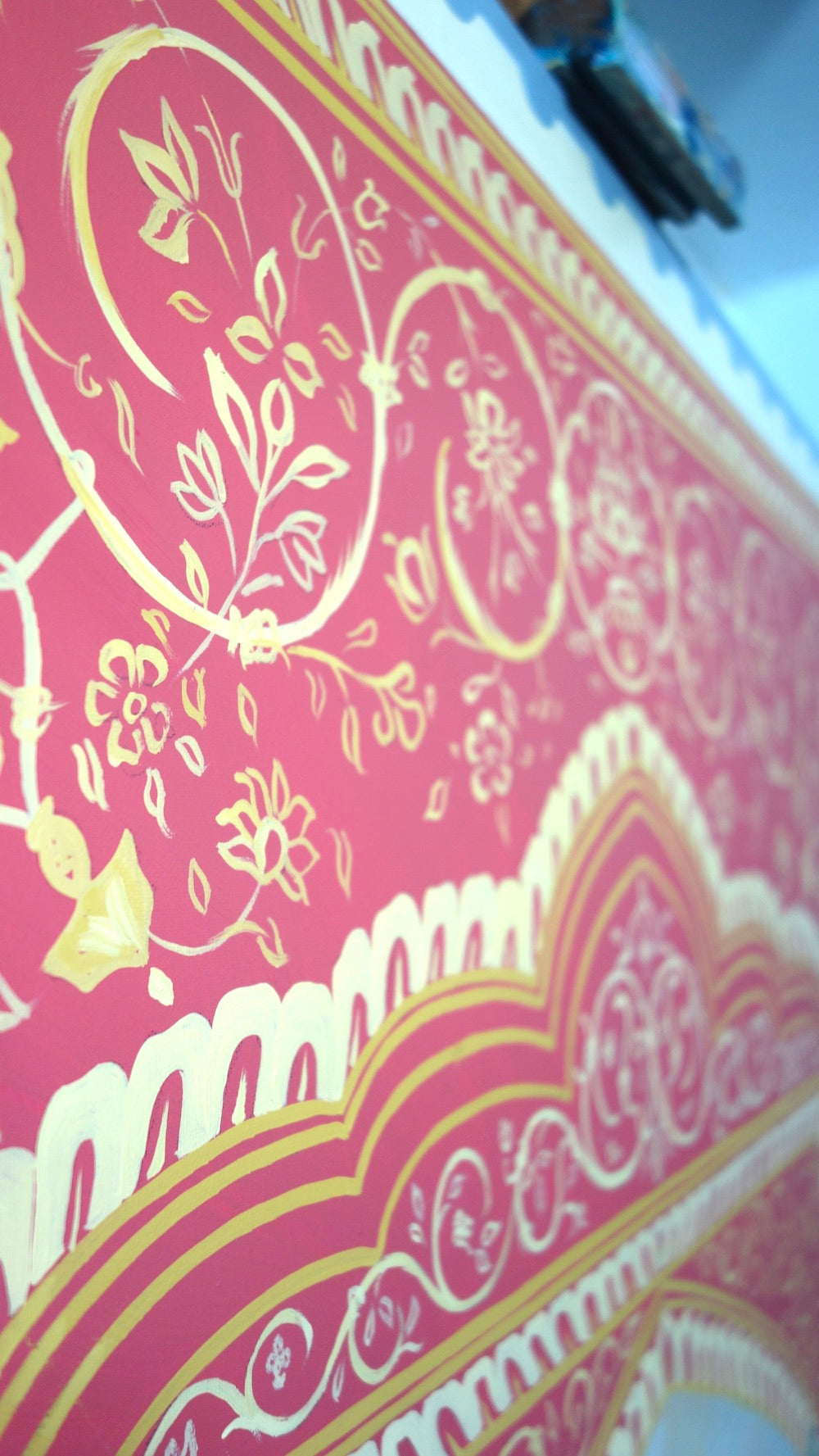 Decorative red and gold patterned fabric with intricate designs. India decorative pattern by pete Hawkins